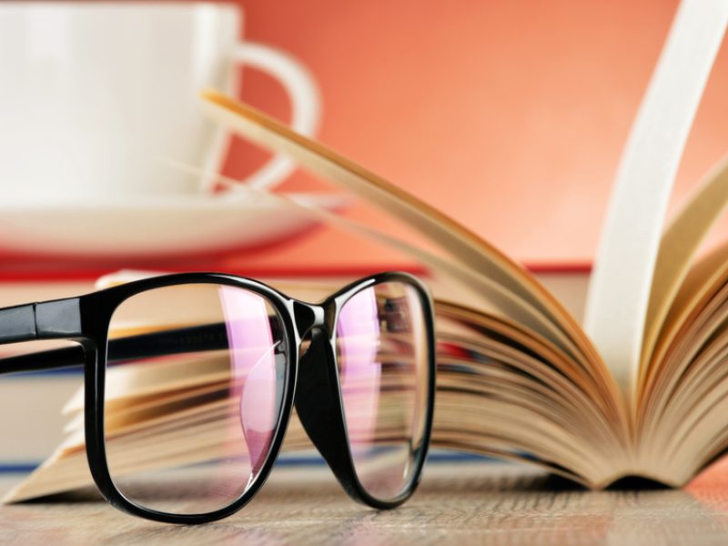 Composition with glasses and books on the table